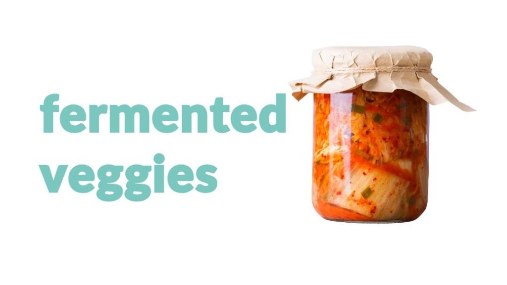 a glass container with kimchi